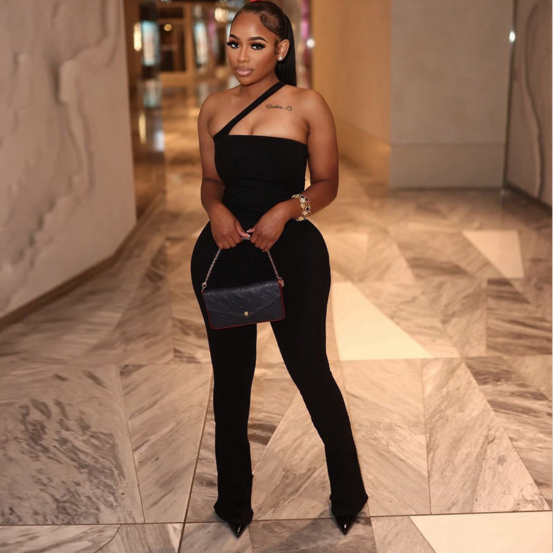 Stylish woman with suitcase wearing a midi dress, chic outerwear, and trendy accessories; ideal travel wardrobe essentials by Perfecsy.