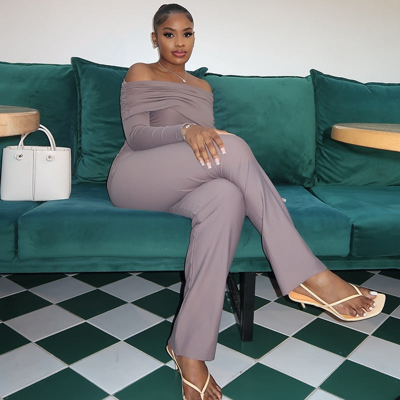 Elegant woman in a flowing satin dress and statement clutch, standing confidently at a chic event, radiating poise and effortless style.